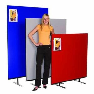 woman stood next to a red, white and a blue office screens
